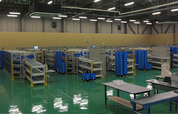 シャッターと表示器、重量検品で分配作業を効率化